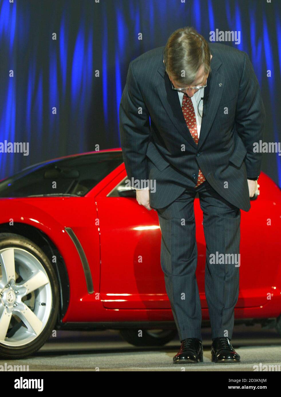 Mazda Motor Corp President And Ceo Lewis Booth Bows In Japanese Style At An Unveiling Of The Carmaker S All New Four Door Four Seater Sports Car Mazda Rx 8 In Tokyo April 9 03 The Car