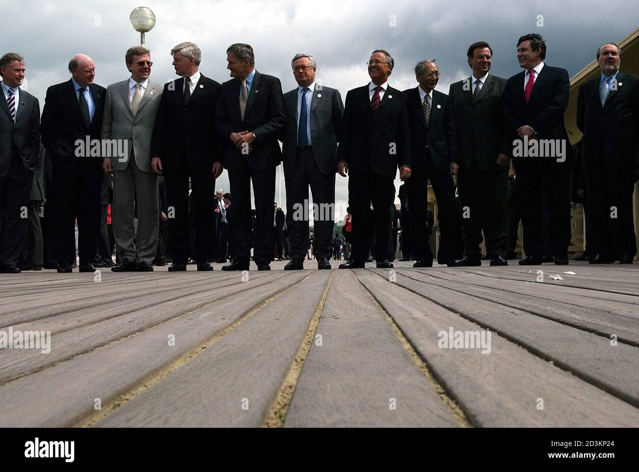 G7 Finance ministers pose for a family photo on the famous promenade ' les planches' in Deauville, Western France, May 17, 2003.  Faced with faltering economies in Europe and Japan and a sliding U.S. dollar, the meeting of ministers from the Group of Seven (G7) club was teeing up the economic agenda for a summit in the French town of Evian in June with longer-term objectives. (L-R) International Monetary Fund General Director Horst Koehler, US treasury Secretary John Snow, Russian minister Alexei Koudrine, Canadian minister John Manley, French minister Francis Mer, Italian minister Giulio Trem Stock Photo