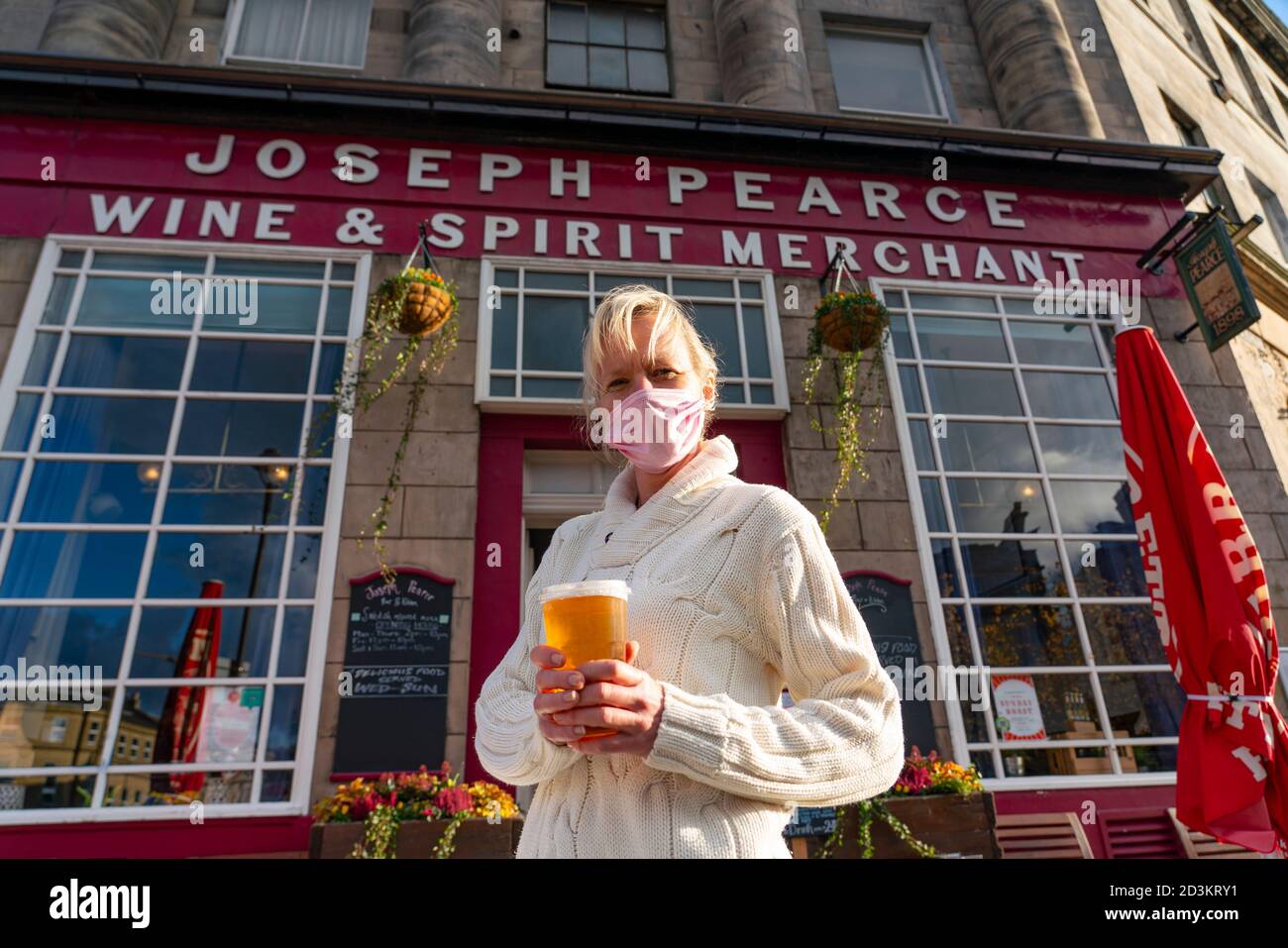 Edinburgh, Scotland, UK. 8 October 2020. Anna  Christopherson, owner of the Boda Bars, stands in front of her pub, Joseph Pearce on Elm Row. Ms Christopherson is angry and confused about the Scottish Government's plans to close pubs from Friday. She says she is is unable to make any plans, for either food and beverage or staffing,  to allow her business to continue when cannot understand the rules being issued by the Scottish Government. The confusion is leading to desperation amongst bar owners as they face a very uncertain future, she says. Iain Masterton/Alamy Live News Stock Photo