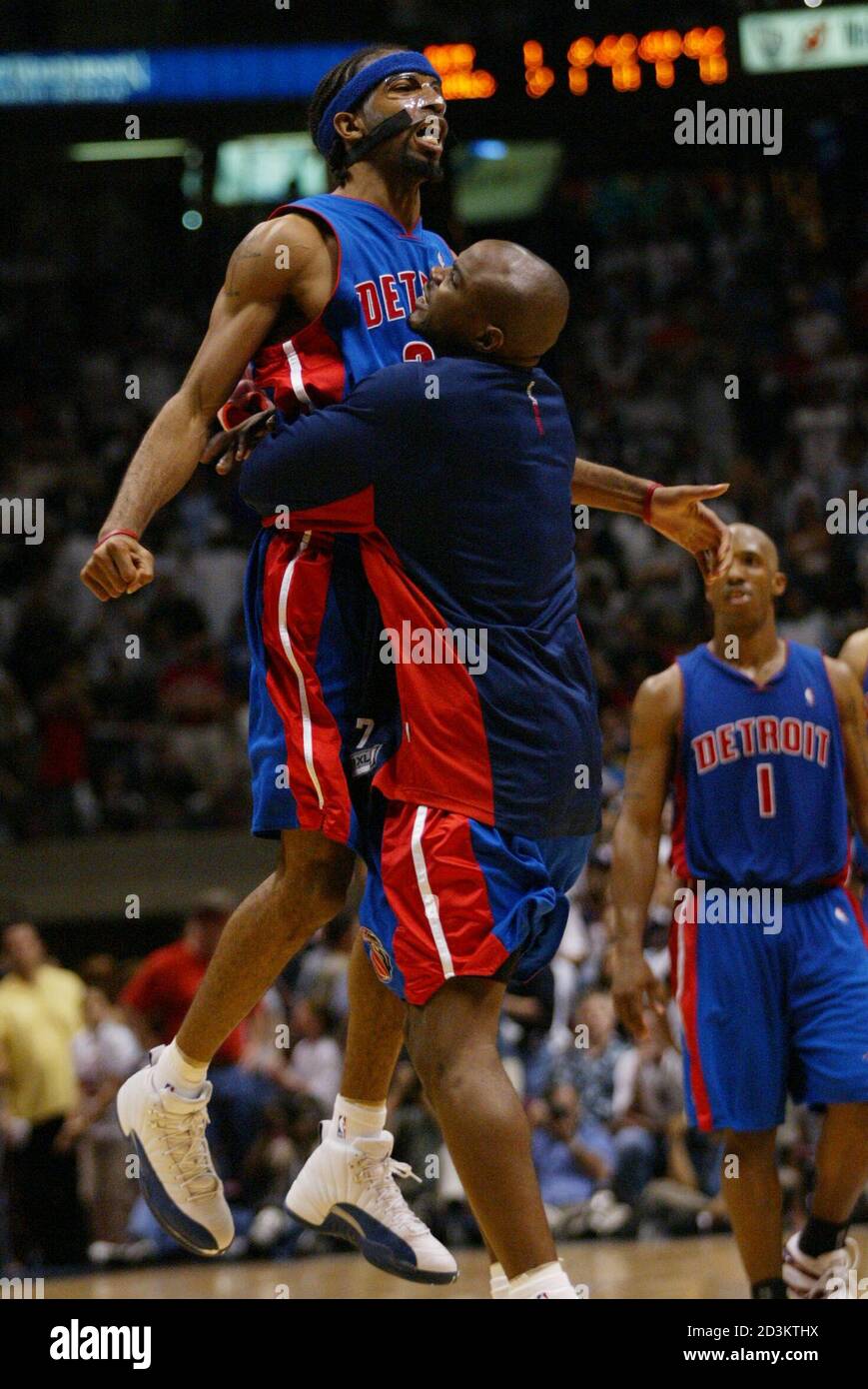 Detroit Pistons guard Richard Hamilton (L) is lifted by his teammate Mike  James after Hamilton made a basket late in the fourth quarter of the  Pistons' 81-75 win over the New Jersey