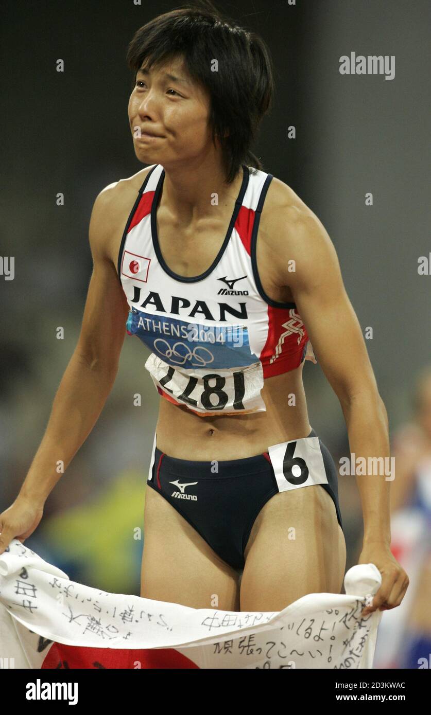 Japan's Yuki Nakata reacts after the women's heptathlon after seven events  at the Athens 2004 Olympic Games August 21, 2004. Sweden's Carolina Kluft  won the heptathlon ahead of Lithuania's Austra Skujyte and