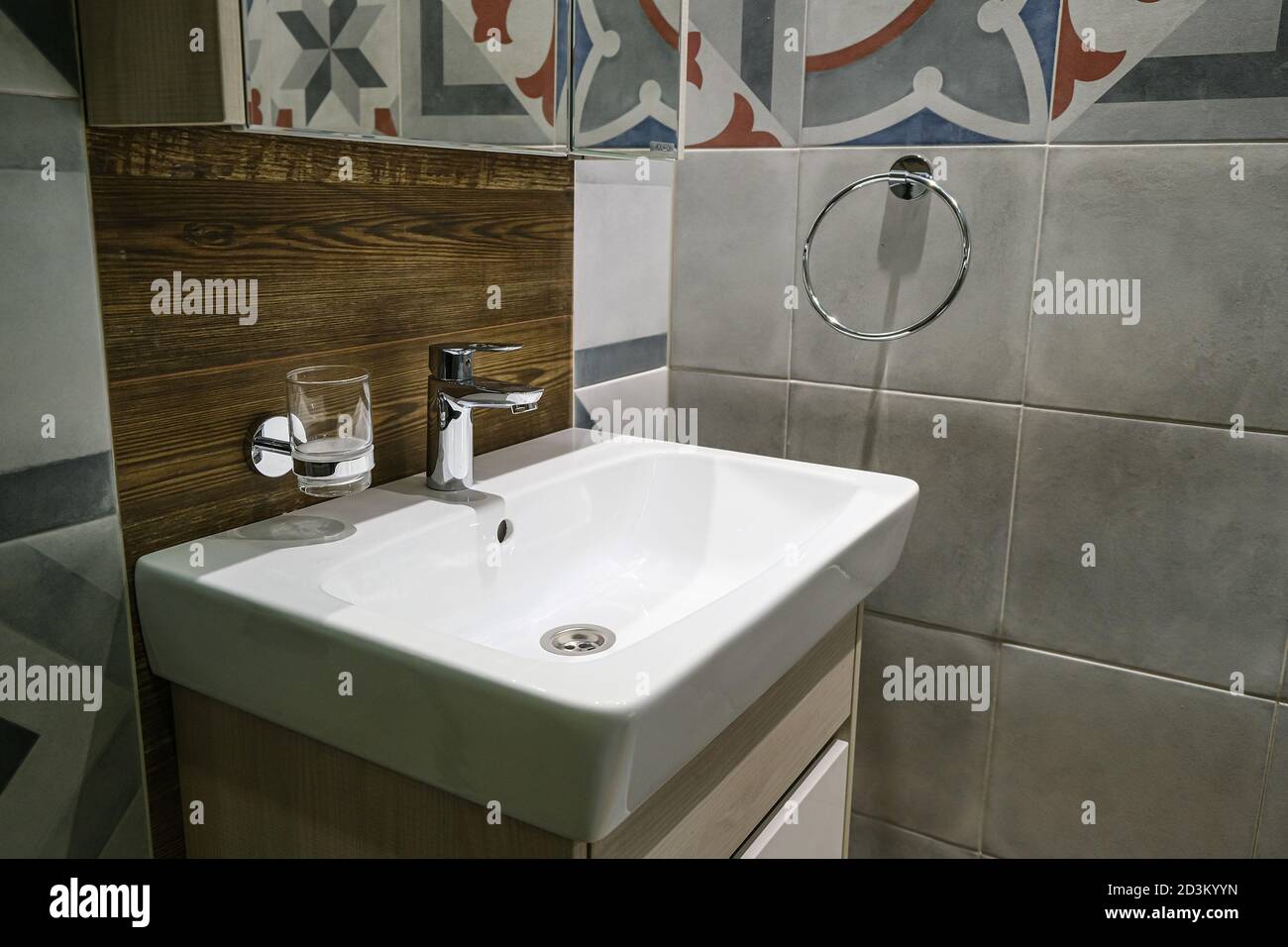 Modern sinks with a mirror in a public toilet. Bachelor's reflection in the mirrors Stock Photo