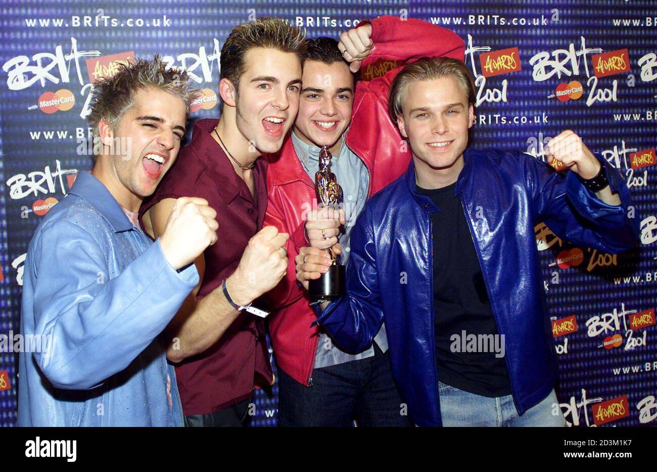 Pop group A1 pose for photographers with their trophy for the Best British  Newcomer at the Brit awards in London's Earls Court arena February 26,  2001. The Brit awards are the British