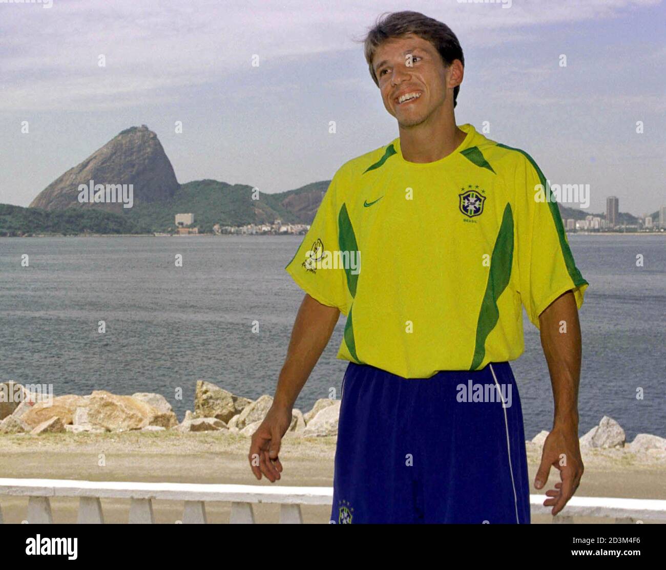 With Sugar Loaf mountain as a backdrop, Brazilian midfielder Juninho  Paulista models the new national soccer team jersey, in Rio de Janeiro  February 1, 2002. Nike's latest creation, denoted "Cool Motion," features