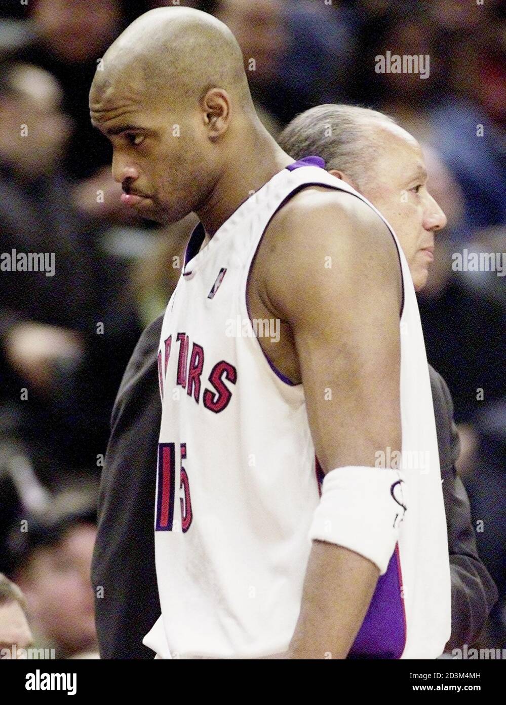 toronto-raptors-vince-carter-walks-past-coach-lenny-wilkens-rear-as-carter-leaves-the-game-against-the-portland-trail-blazers-in-the-fourth-quarter-in-toronto-march-1-2002-the-raptors-extended-their-losing-streak-to-10-games-losing-91-81-to-portland-reutersmike-cassese-mcsv-2D3M4MH.jpg