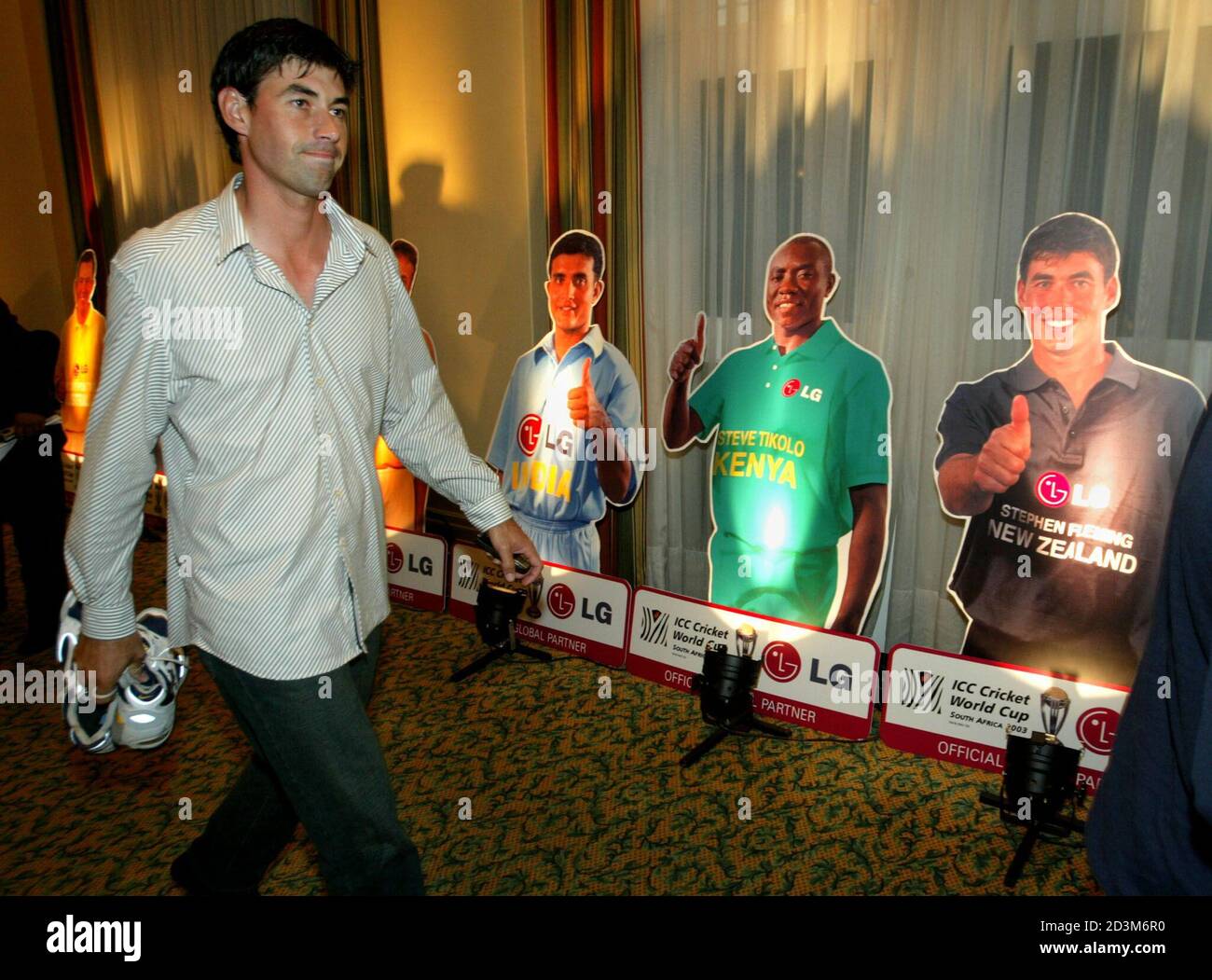 New Zealand Cricket Team Captain Stephen Fleming Passes By Posters Of Other Captains Including Himself Far R While Attending A Cricket World Cup Promotional Event In Cape Town February 7 03 The