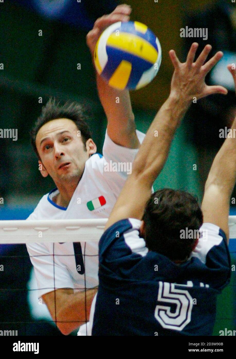 Italian Andrea Sartoretti Spikes The Ball Over Valera Of Venezuela During The Men S Volleyball World Cup In Nagano Central Japan Stock Photo Alamy