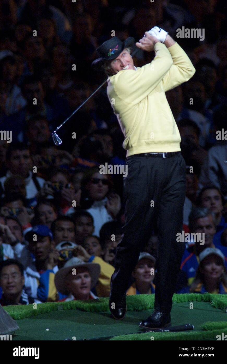 Australian golfer Greg Norman performs during the closing ceremonies of the Olympic Games in Sydney on October 1, 2000 following 16 days of competition. next games are scheduled to be held