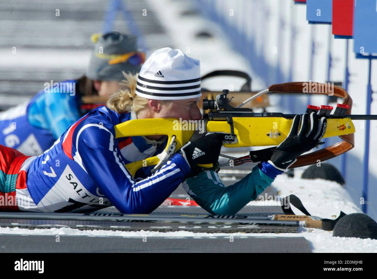 Norwegian biathlete Gunn Margit Andreassen (front) and Japanese Mami Shindo  shoot during the women's 15k individual Olympic biathlon at Soldier Hollow  during the Salt Lake 2002 Olympic Winter Games February 11, 2002.