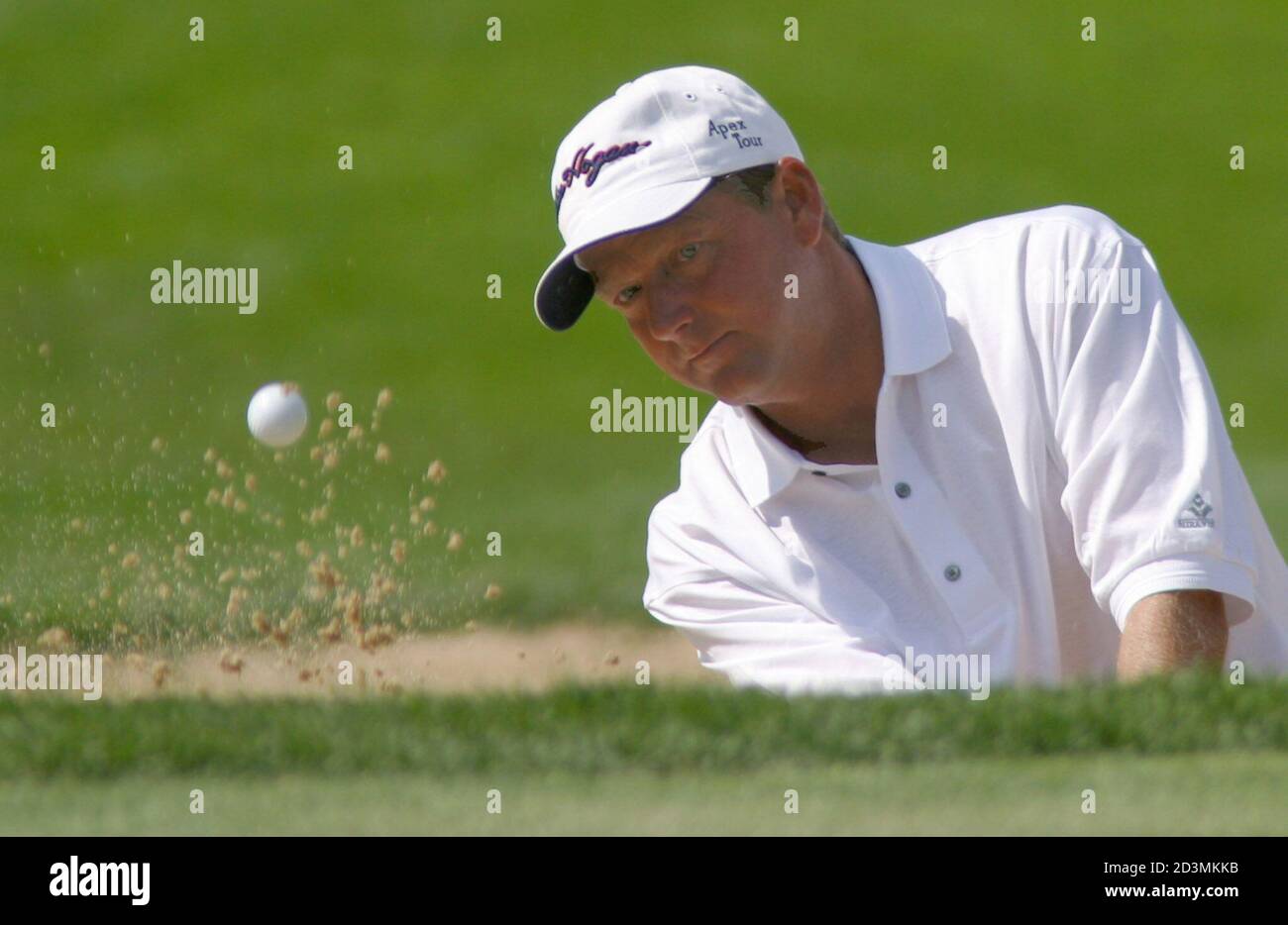 Mark Brooks of the USA hits from the bunker on the ninth hole during the second round of The International, in Castle Rock, Colorado, August 2, 2002. Brooks is among the early leaders on day two of the modified Stableford scoring tournament. REUTERS/Gary C. Caskey  GCC/HB Stock Photo