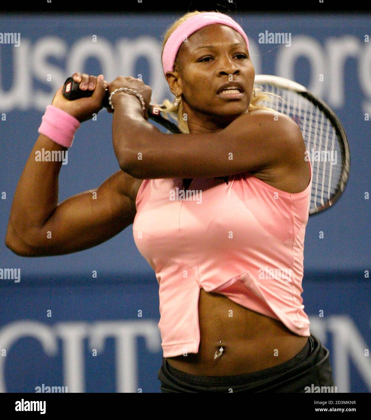 Serena Williams of the United States displays a belly button piercing  during her U.S. Open match