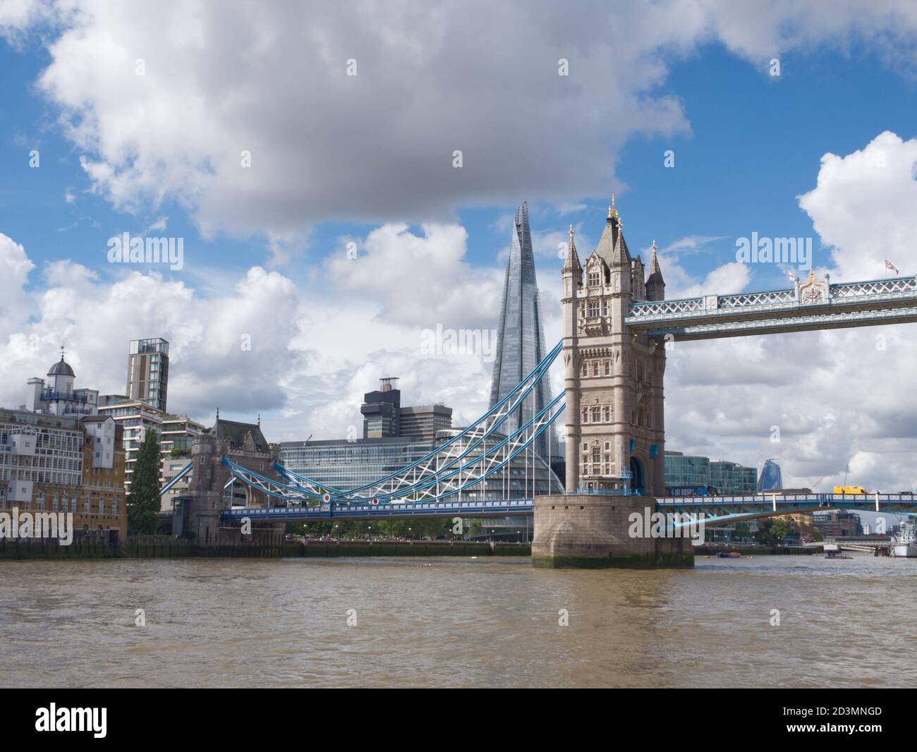 London's historic, iconic Tower Bridge, raised hydraulically. Spanning the River Thames in the heart of the City of London. Magnificent Architecture Stock Photo
