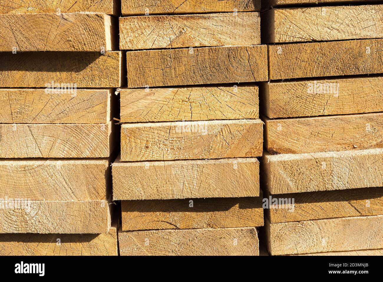 Wooden boards are stored outdoors. Wood texture Stock Photo