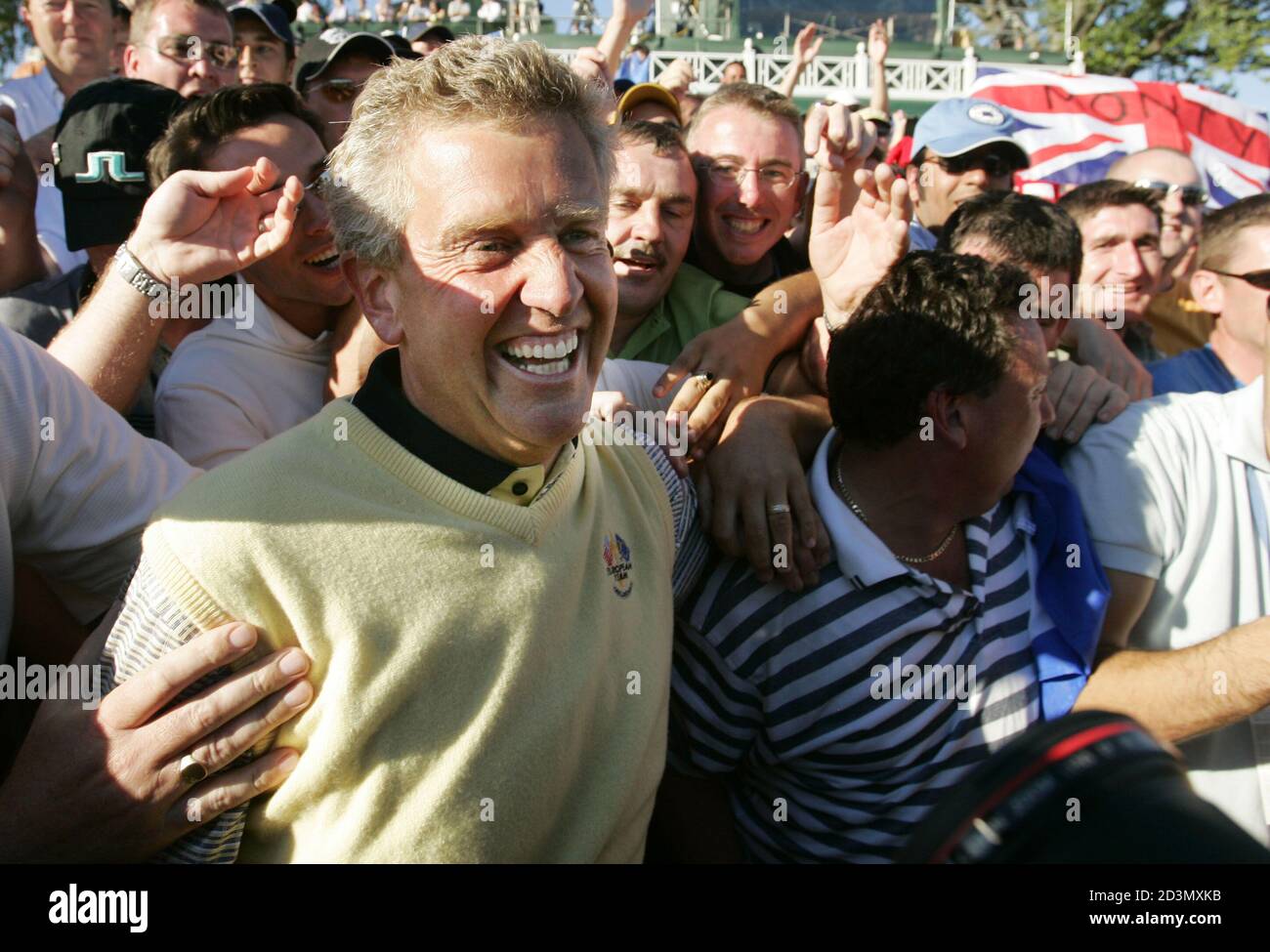 European Ryder Cup golfer Colin Montgomerie from Scotland celebrates with fans after clinching the Ryder Cup victory for Europe, with a victory over U.S. golfer David Toms at the 35th Ryder Cup Matches in Bloomfield, Michigan September 19, 2004. Europe defeated the U.S. 18 1/2 to 9 1/2 to win the cup. REUTERS/Mike Blake pictures of the month September 2004  GMH/SV Stock Photo
