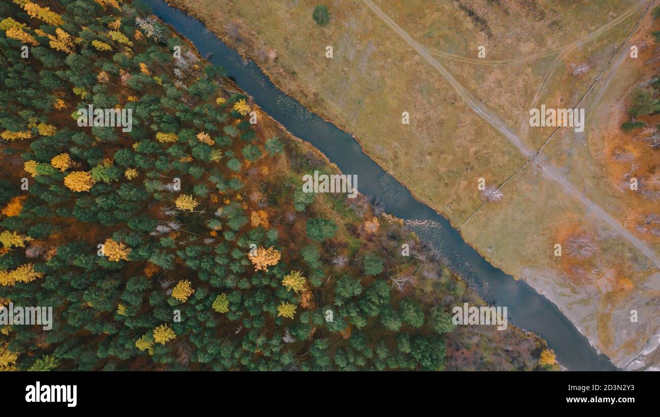 Top view of autumn nature. River, forest, and field Stock Photo