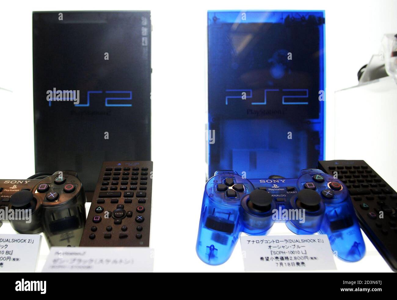 Sony Computer Entertainment Inc's PlayStation 2 Ocean Blue colour model (R)  is displayed alongside the Zen Black model in a glass case as sales of the  blue model begin in Tokyo July