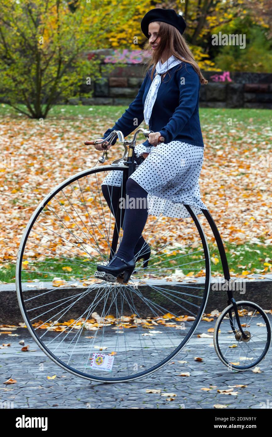 Woman on Penny Farthing bicycle Stock Photo