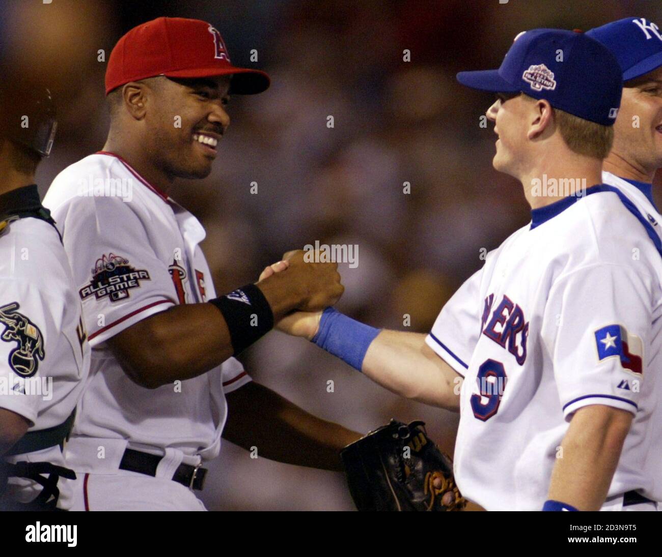 Texas Rangers' Hank Blalock (R) celebrates the American League's victory  with MVP Garret Anderson of the Anaheim Angels at the end of the 74th  annual Major League All-Star game in Chicago, July