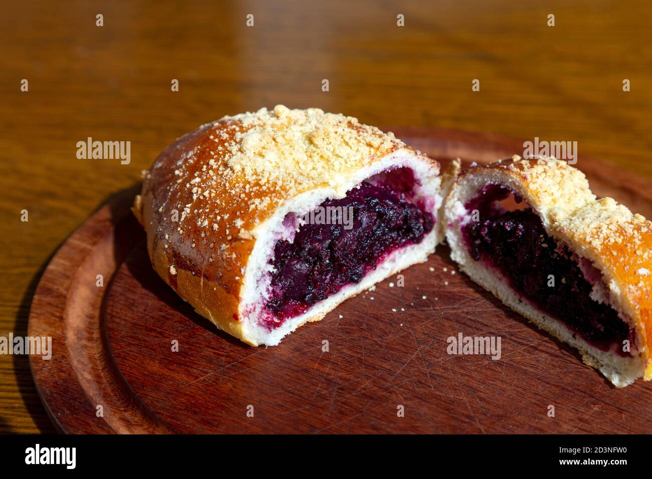 Typical traditional Polish sweet blueberry bun (jagodzianka) Stock Photo
