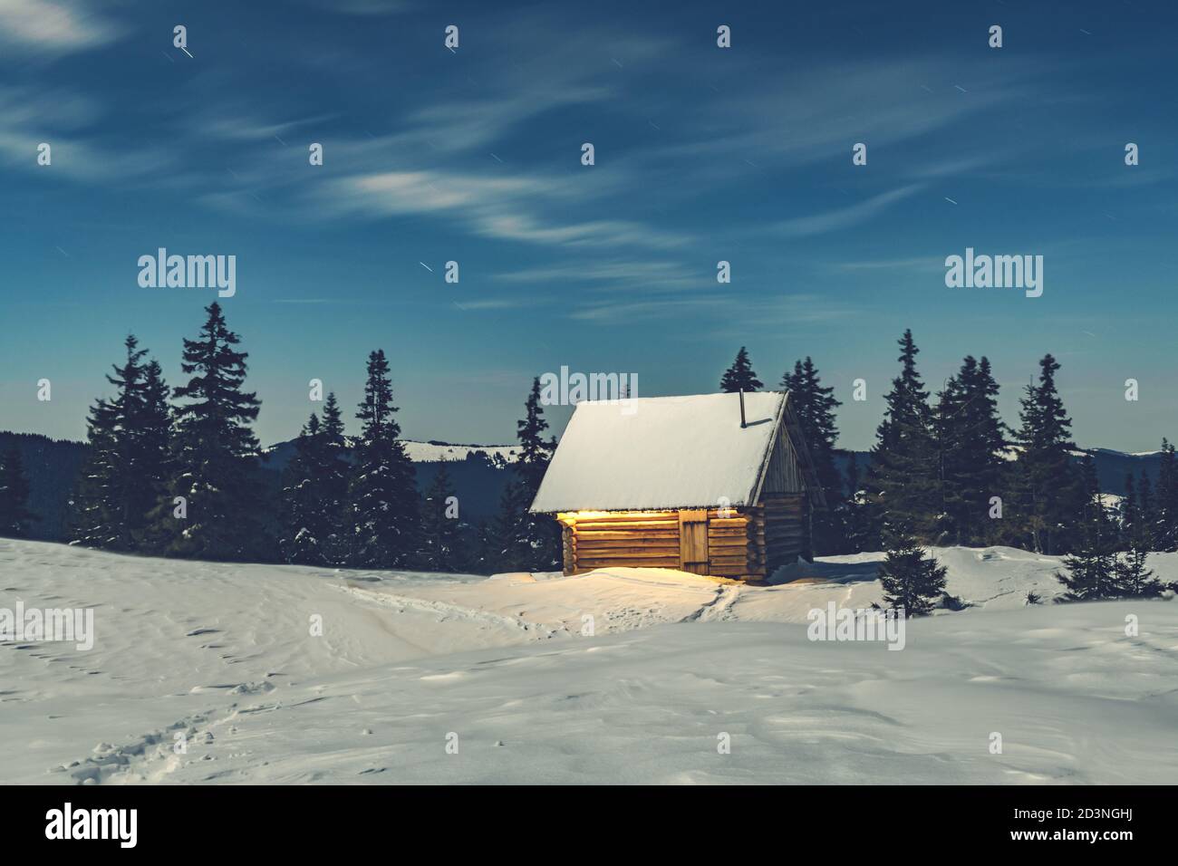 Fantastic winter landscape with wooden house in snowy mountains ...