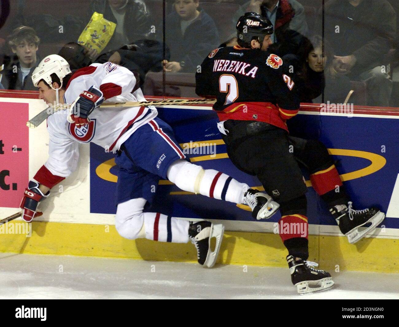 Calgary Flames' Brad Werenka collides with Montreal Canadiens' Gino Odjick  during the first period of NHL action in Montreal, December 13, 2000. SB/ME  Stock Photo - Alamy