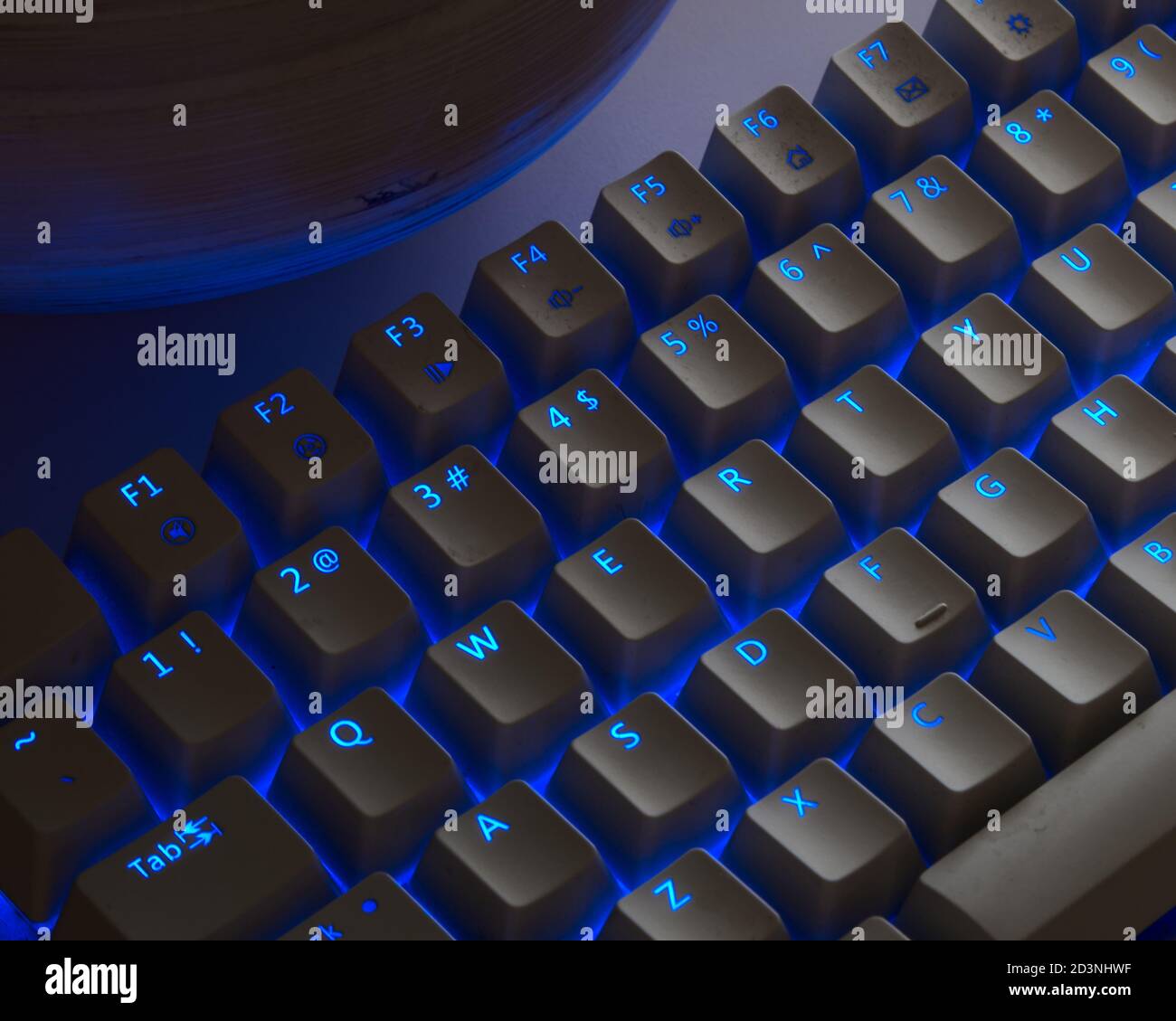Computer keyboard back lit by blue LEDs Stock Photo - Alamy