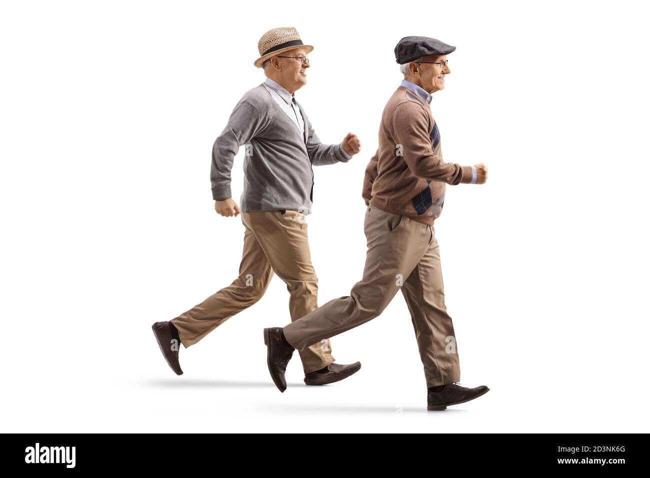 Two elderly men running isolated on white background Stock Photo
