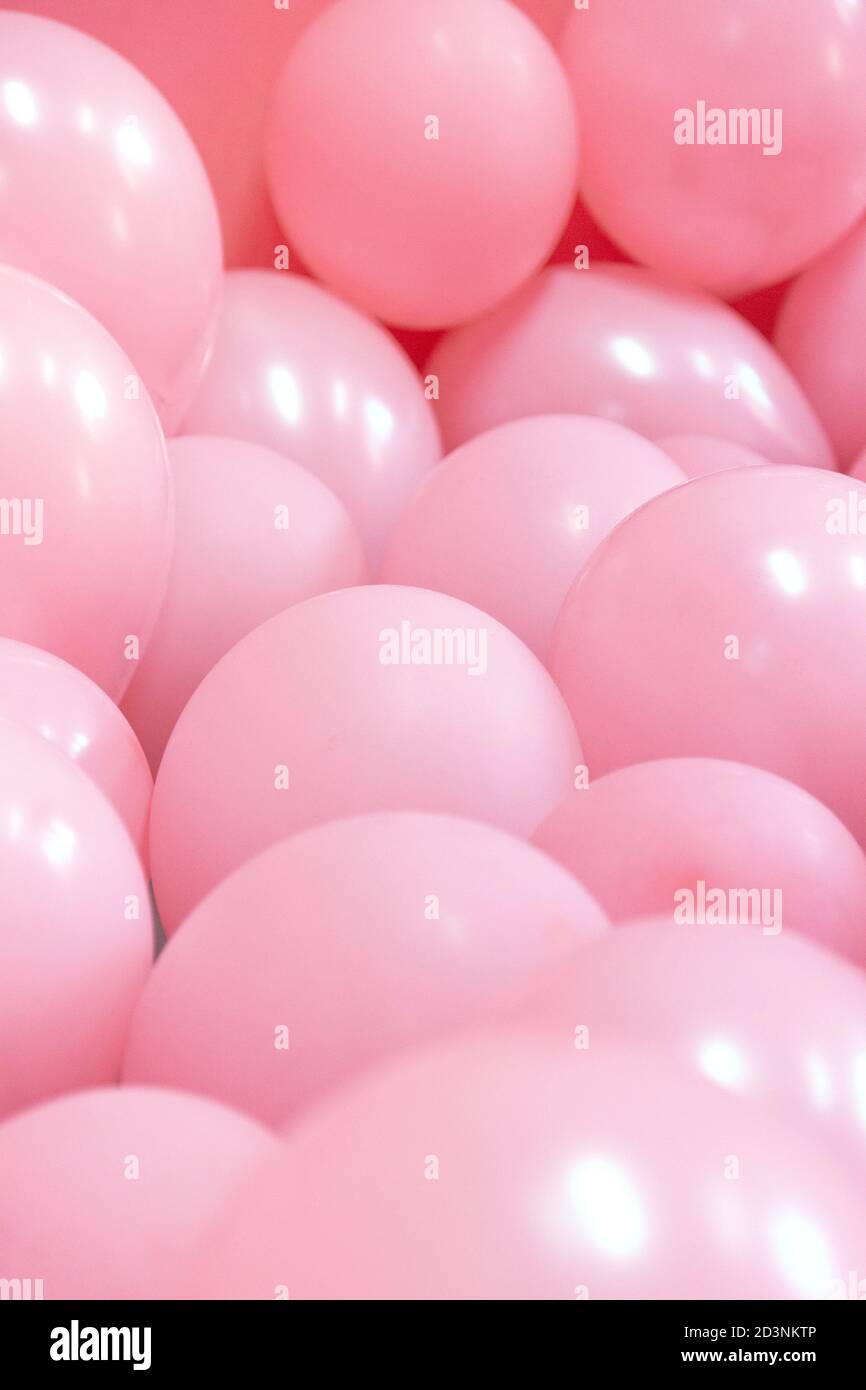 Pink background balloons hi-res stock photography and images - Alamy