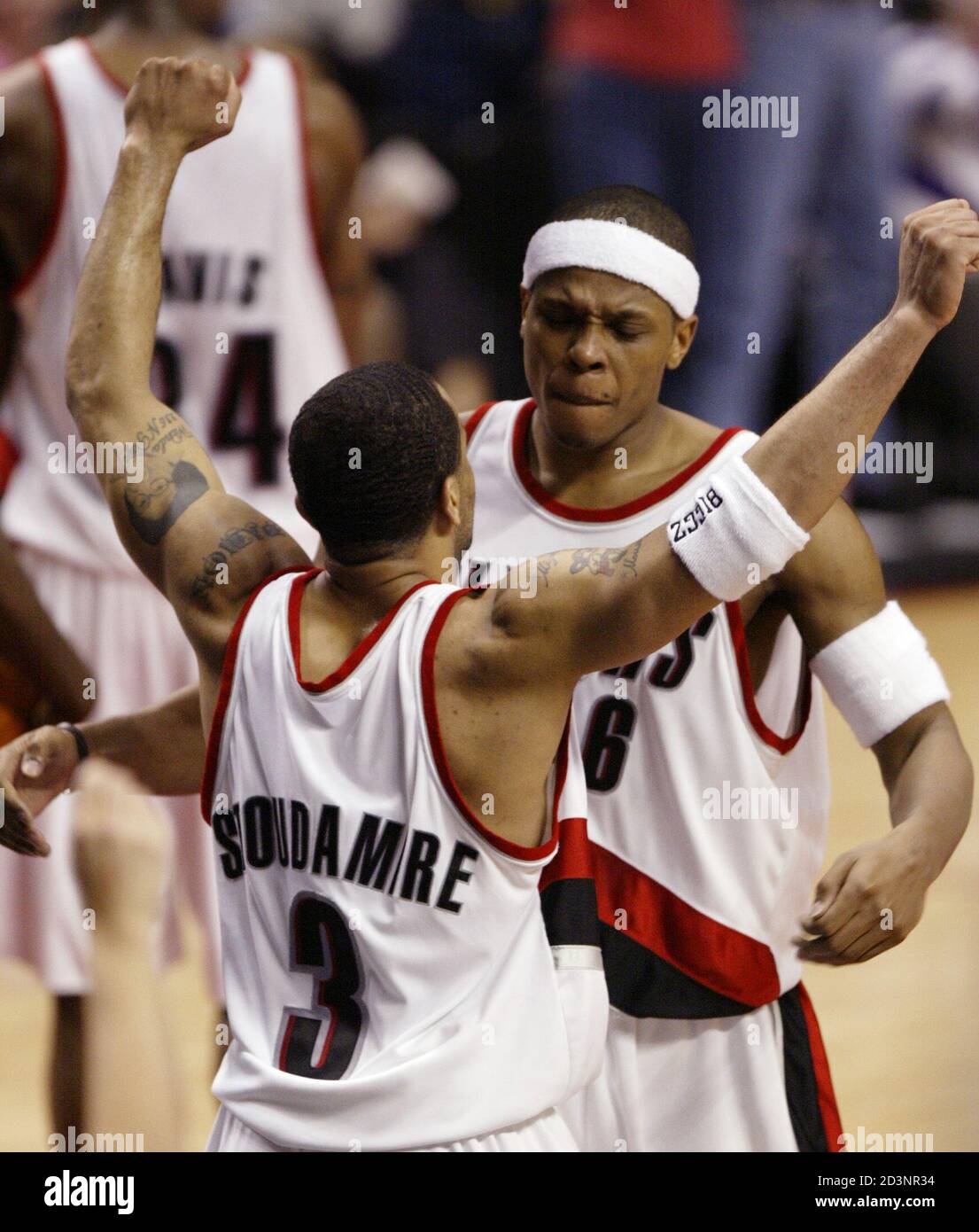 Portland Trail Blazers Damon Stoudamire (3) and Bonzi Wells (R) celebrate a  basket during the third quarter of their NBA playoff game against the  Dallas Mavericks in Portland on April 27, 2003.