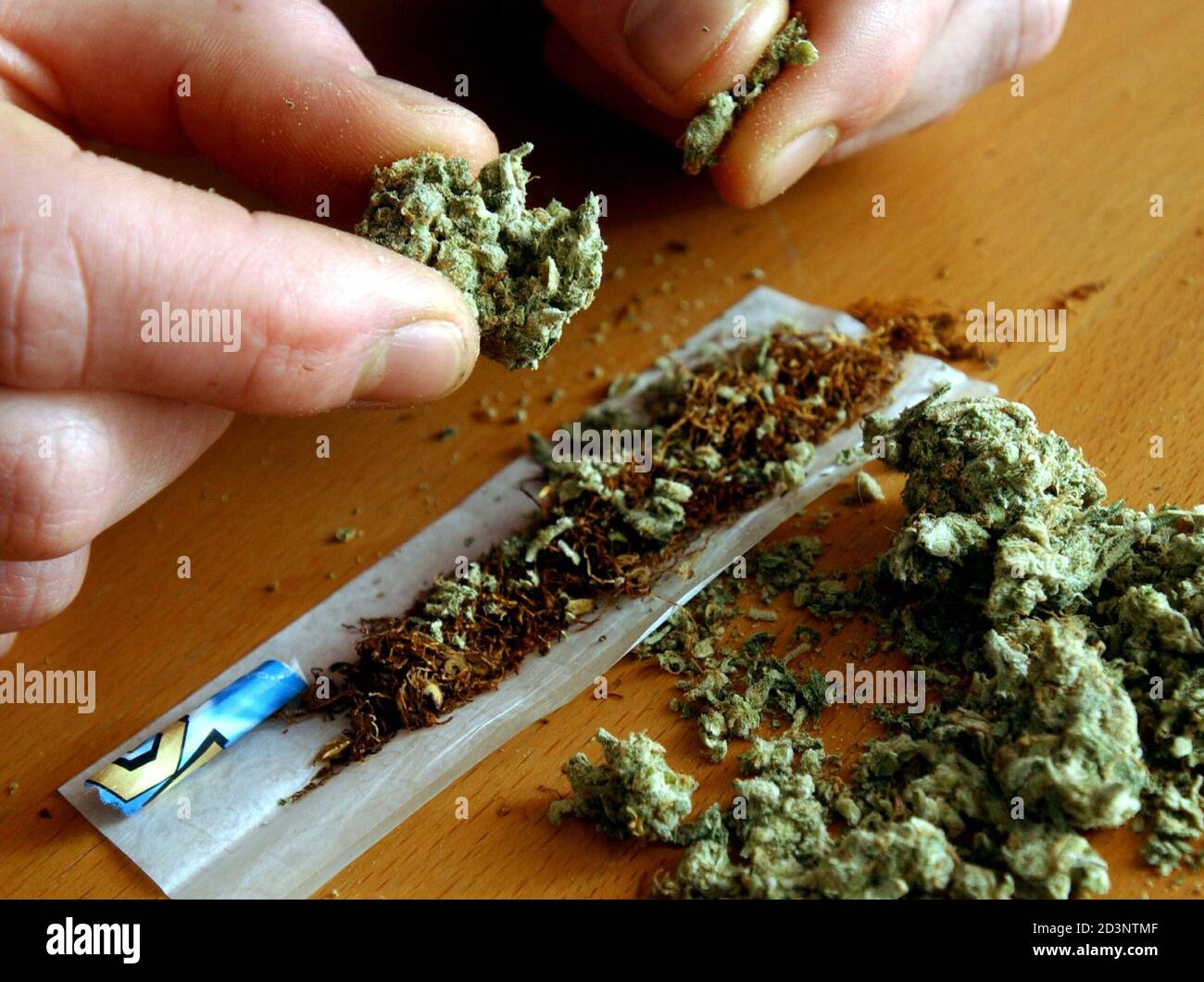 An Unidentified Man Makes A Cannabis Cigarette At A House In London Before The Relaxation Of Cannabis Laws January 24 2004 The Drug Is Due To Be Reclassified In The Uk From