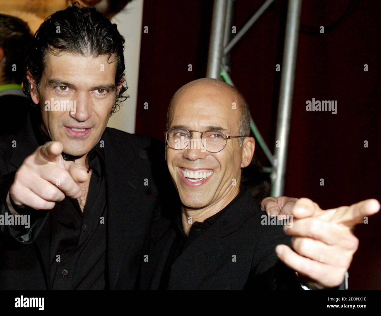 EXECUTIVE PRODUCER OF SHREK 2 JEFFREY KATZENBERG POSES WITH ANTONIO BANDERAS AT THE AUSTRALIAN PREMIERE OF SHREK 2 IN SYDNEY.  Antonio Banderas (L) and executive producer of Shrek 2 Jeffrey Katzenberg (R) pose for photographs before the Australian premiere of Shrek 2 at a theatre in Sydney June 9, 2004. The animation hit follows on from the first movie but with added stars voicing for the animated characters. REUTERS/Will Burgess Stock Photo