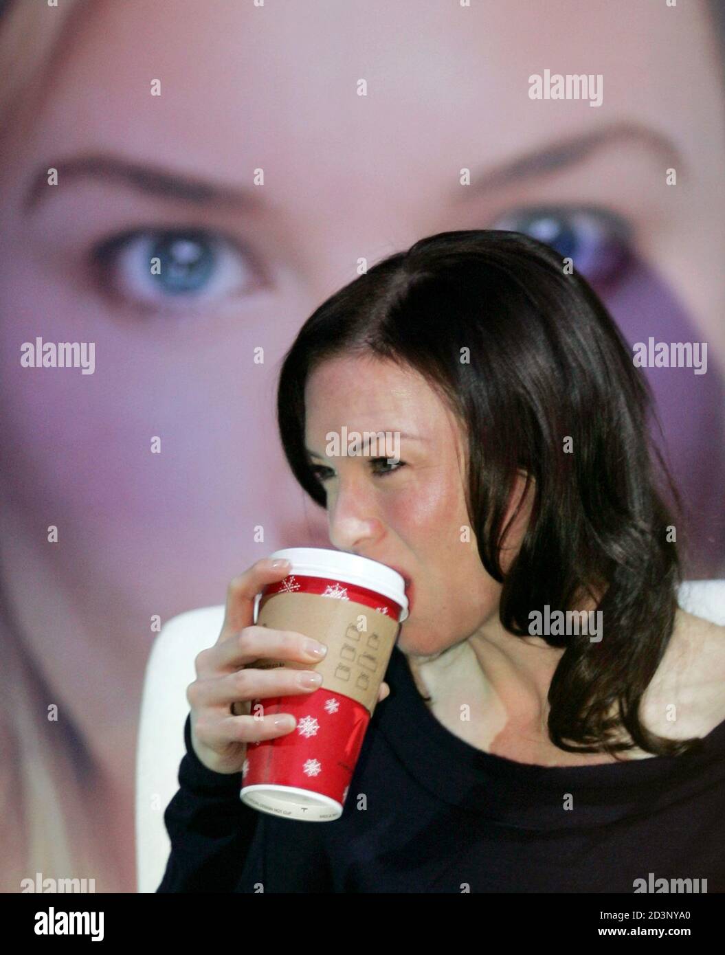 Renee Zellweger Drinks A Coffee In Front Of A Poster For Bridget Jones The Edge Of Reason In Seoul U S Actress Renee Zellweger Drinks A Coffee In Front Of A Poster