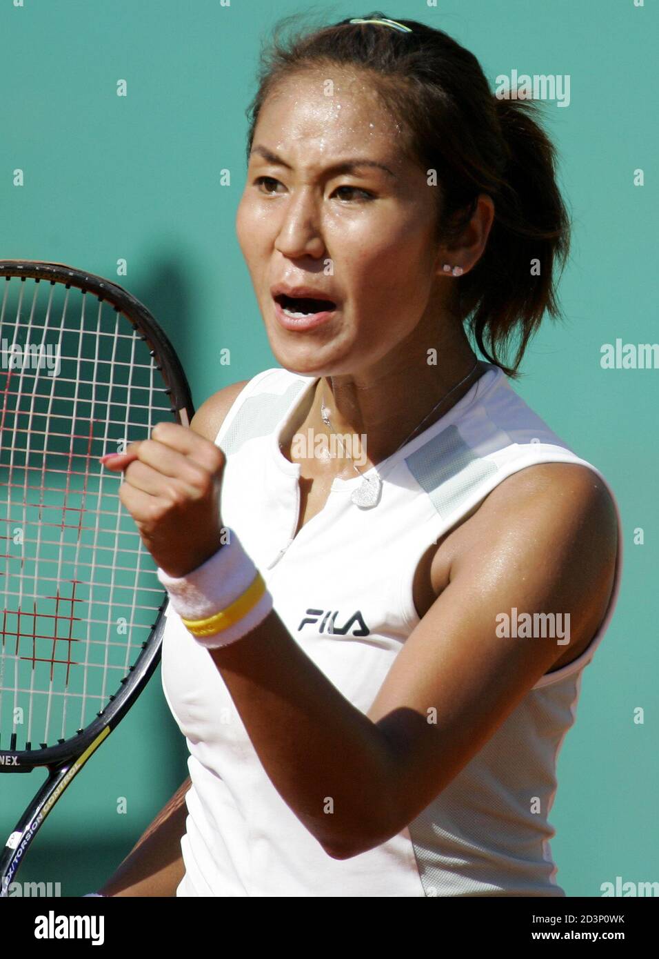Japan's Morigami reacts after scoring a point during her match against Dementieva of Russia in the French tennis open at Roland Garros stadium.   Japan's Akiko Morigami reacts after scoring a point during her match against fourth seed Elena Dementieva of Russia in the French tennis open at Roland Garros stadium, May 27, 2005. REUTERS/Charles Platiau Stock Photo