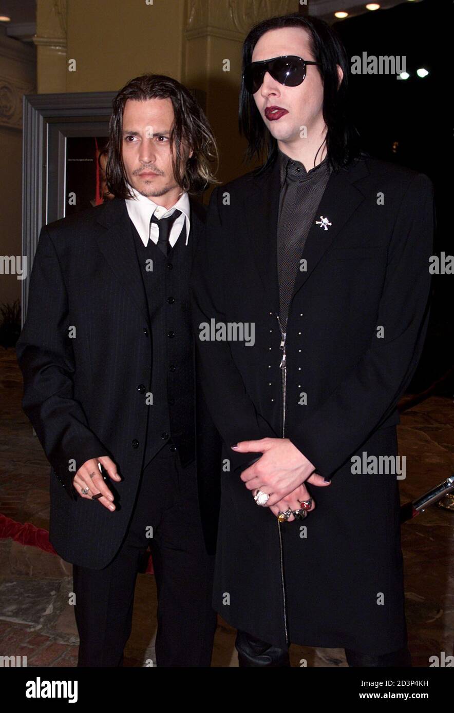 Actor Johnny Depp, star of the new film "From Hell" poses with singer  Marilyn Manson (R) at the film's premiere in Los Angeles October 17, 2001.  The film about the infamous killer