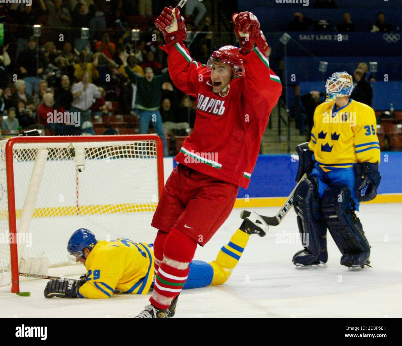 Forward Vasily Pankov of Belarus (C) celebrates his team's game-winning  goal as Swedish forward Kenny Jonsson (L) lays on the ice and Swedish  goalie Tommy Salo (R) skates away during the third