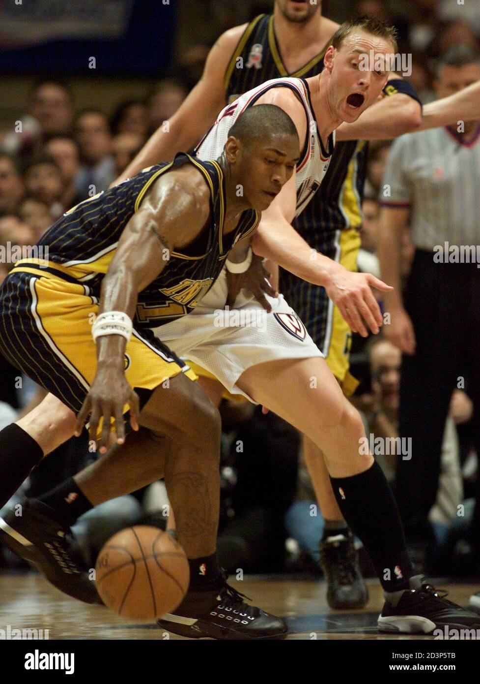Indiana Pacers forward Ron Artest (L) battles the defense of New Jersey  Nets forward Keith Van Horn for the ball during the first quarter of Game 5  of their NBA playoff series