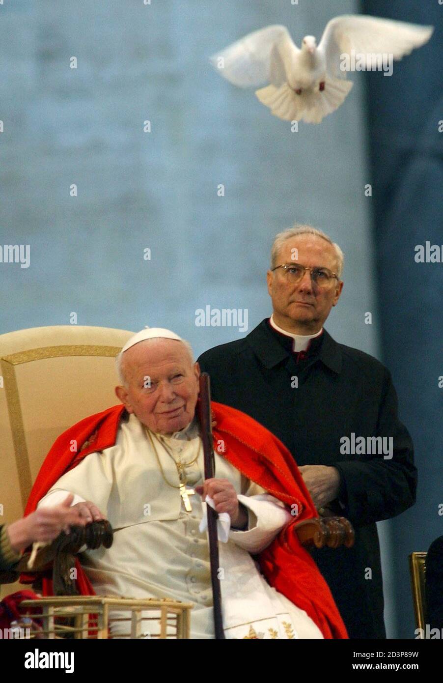 A doves flies over Pope John Paul II during his meeting with young people  in Saint Peter's Square at the Vatican April 10, 2003. The pontiff said  youth have to promote the
