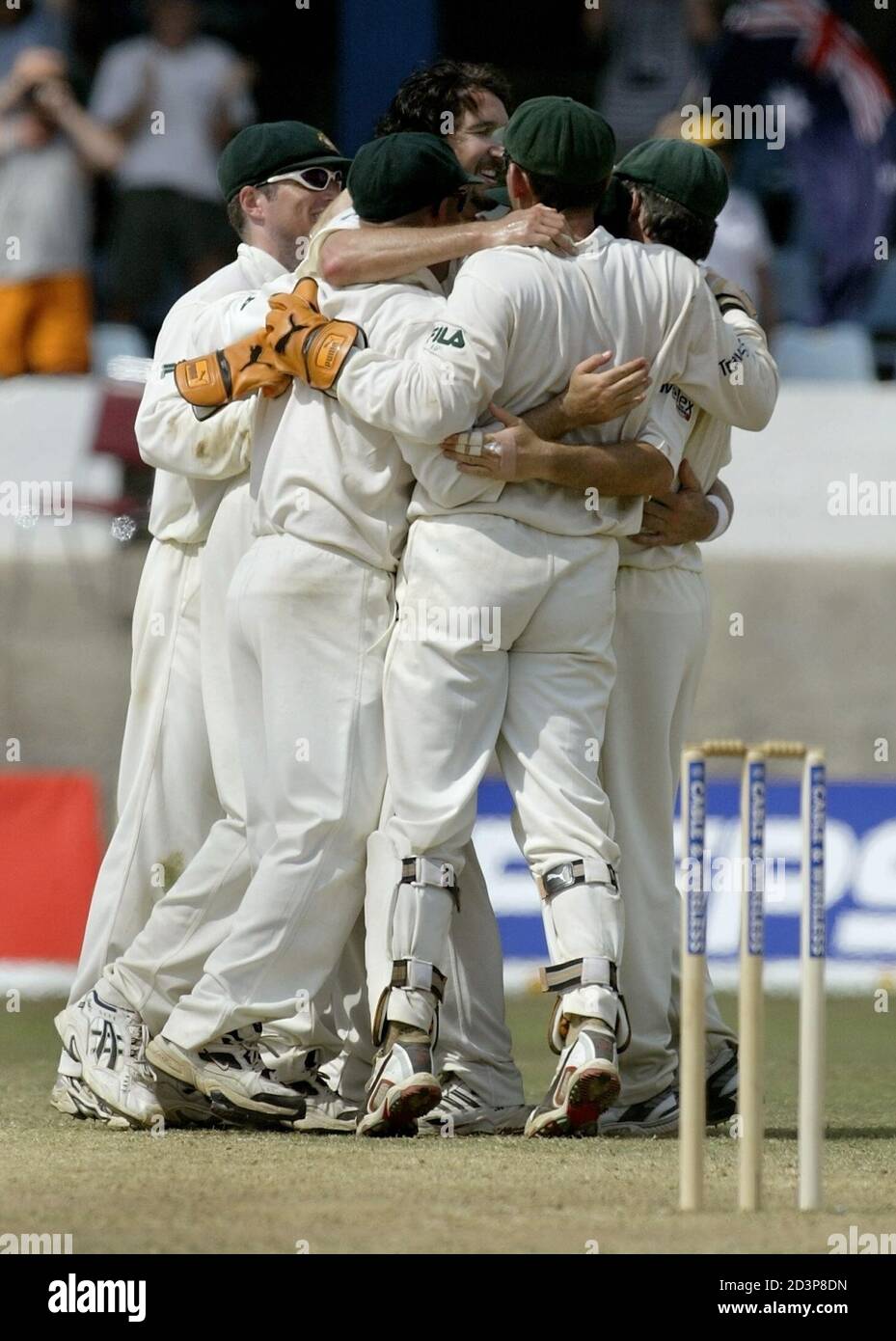 Members of the Australian cricket team clebrate taking the last wicket and winning the second test over West Indies in Port of Spain, Trinidad April 23, 2003. Australia defeated West Indies by 118 runs. REUTERS/Andy Clark REUTERS  AC Stock Photo