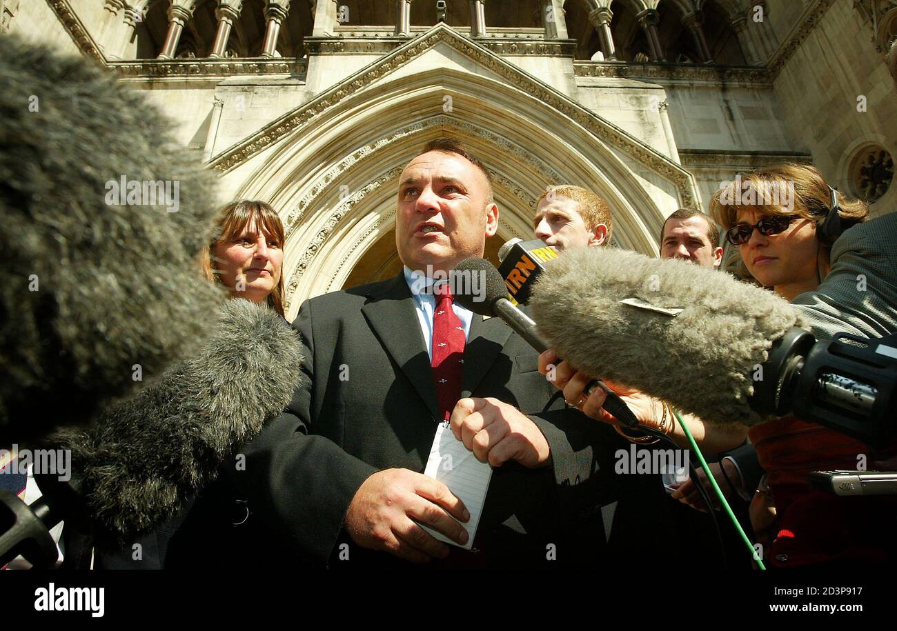 British Gulf War veteran, former Parachute Regiment medical officer Shaun Rusling, talks to the media after the High Court upheld a ruling that he is entitled to a pension because he is suffering from a syndrome linked to his service in the 1991 Gulf War, in London, June 13, 2003. The ruling may make it easier for other veterans who say their health has been wrecked to claim damages, although the judge made it clear that the ruling does not mean official recognition of the generic concept of Gulf War Syndrome and that subsequent cases would be considered on their individual merits. REUTERS/Pet Stock Photo