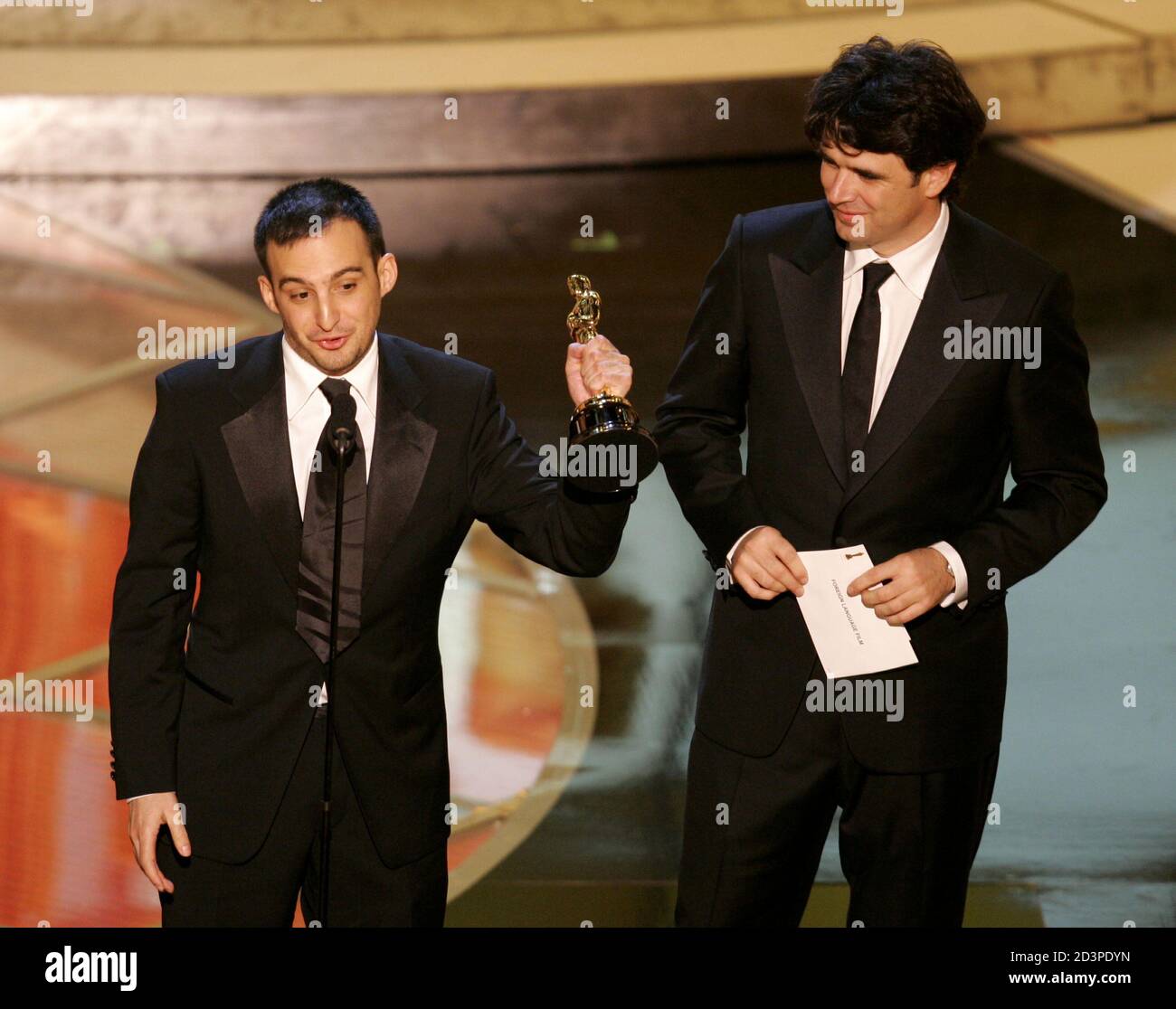 Director Alejandro Amenabar and producer Fernando Bovaira accept the award for best foreign film for the Spanish film 'The Sea Inside' at the 77th annual Academy Awards in Hollywood, February 27, 2005. Stock Photo