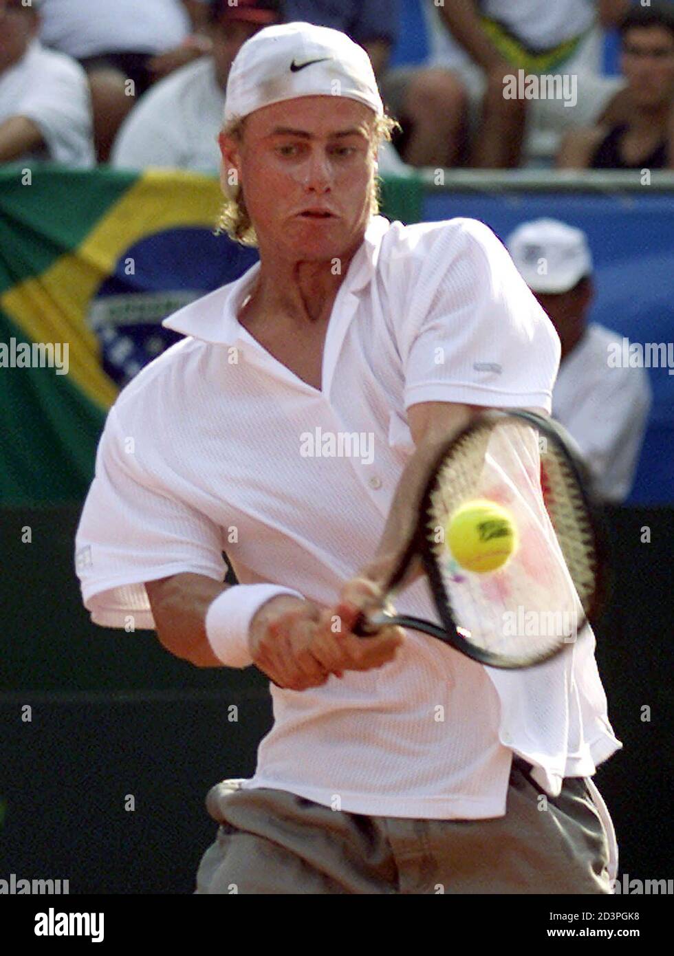 Australian tennis player Lleyton Hewitt plays a backhand against Brazilian  Fernando Meligeni during his Davis Cup quarter final match in  Florianopolis, April 6, 2001. Hewitt defeated Meligeni 6-3 6-3 6-3 and  Brazil