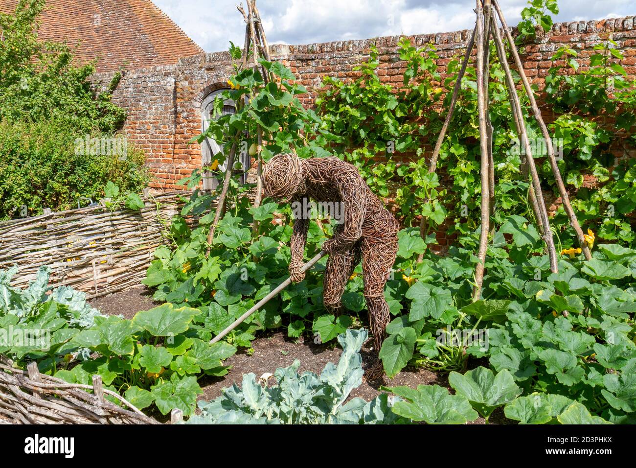 Wicker man figure in the Tudor walled garden, Cressing Temple Barns, Essex, UK. Stock Photo