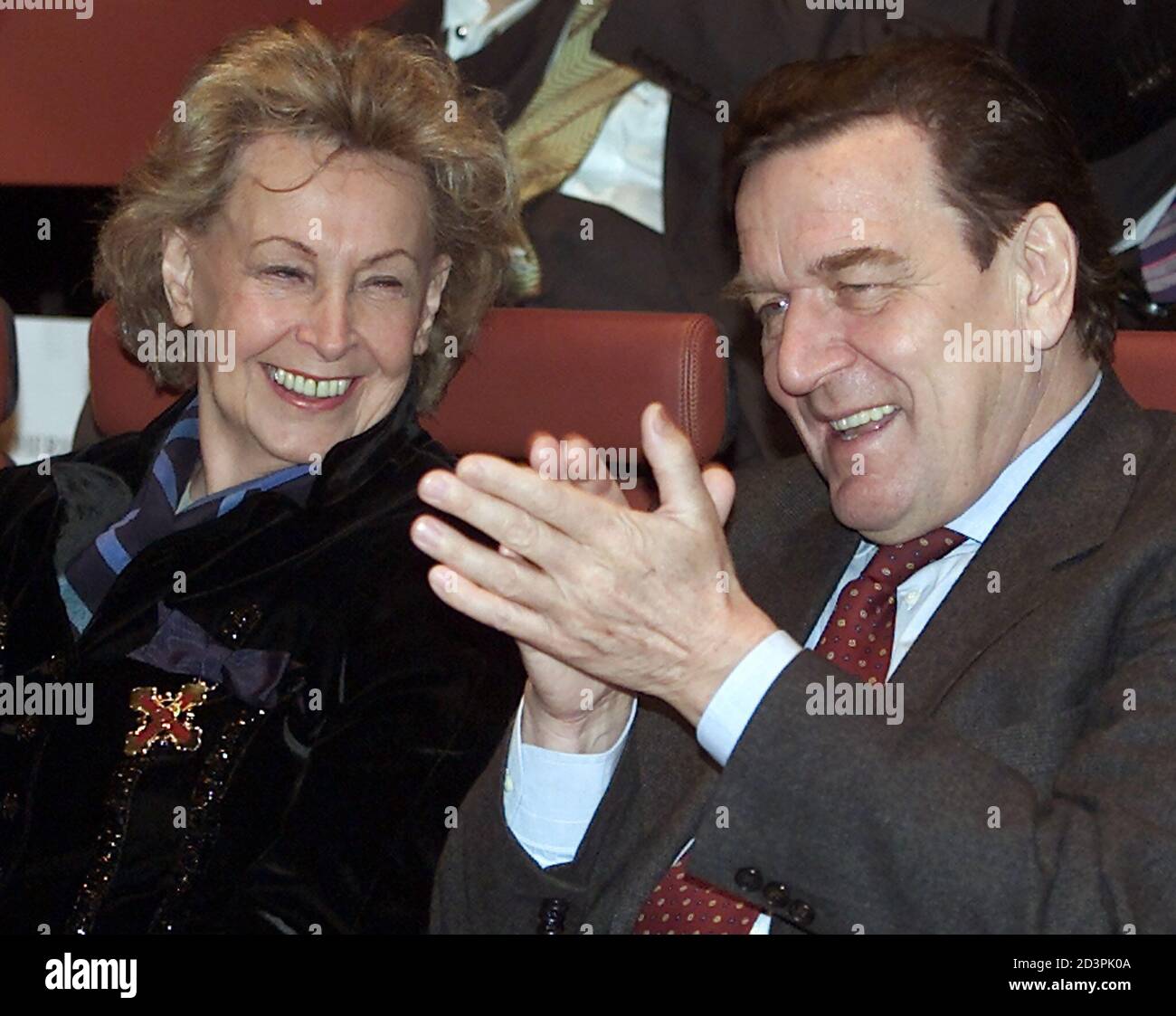 Rut Brandt (L), widow of former German Chancellor Willy Brandt smiles as she sits beside German Chancellor Gerhard Schroeder during a ceremony at the Norwegian embassy in Berlin December 3, 2001. Rut Brandt was honoured with the Norwegian royal medal for her services to Norway. REUTERS/Tobias Schwarz REUTERS  FAB/JOH Stock Photo