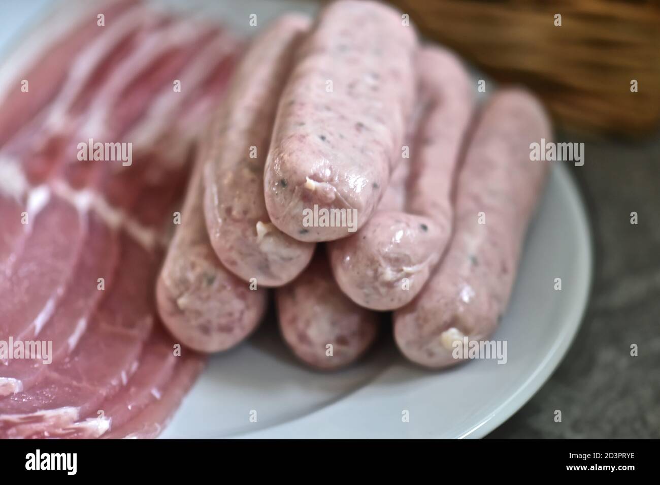 Raw sausage and bacon Stock Photo Alamy