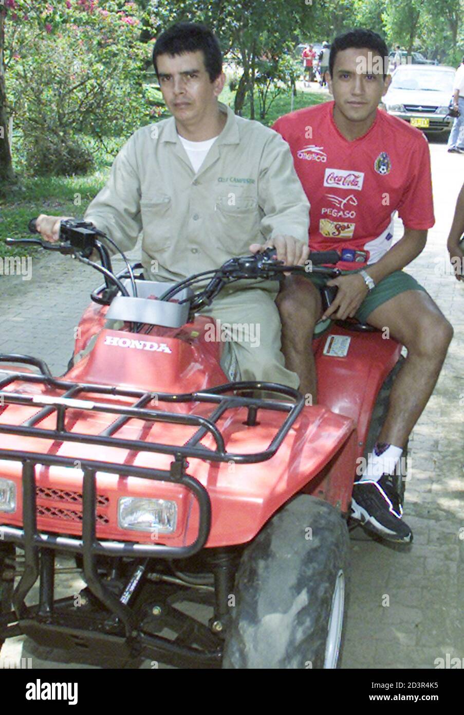Mexican Ramon Morales rides an ATV to the training field at the Campestre Club in Cali where the team is staying during the Copa America, July 13, 2001. Mexico upset Brazil in their first match of the tournament and plays Paraguay on July 15. RR/SV Stock Photo