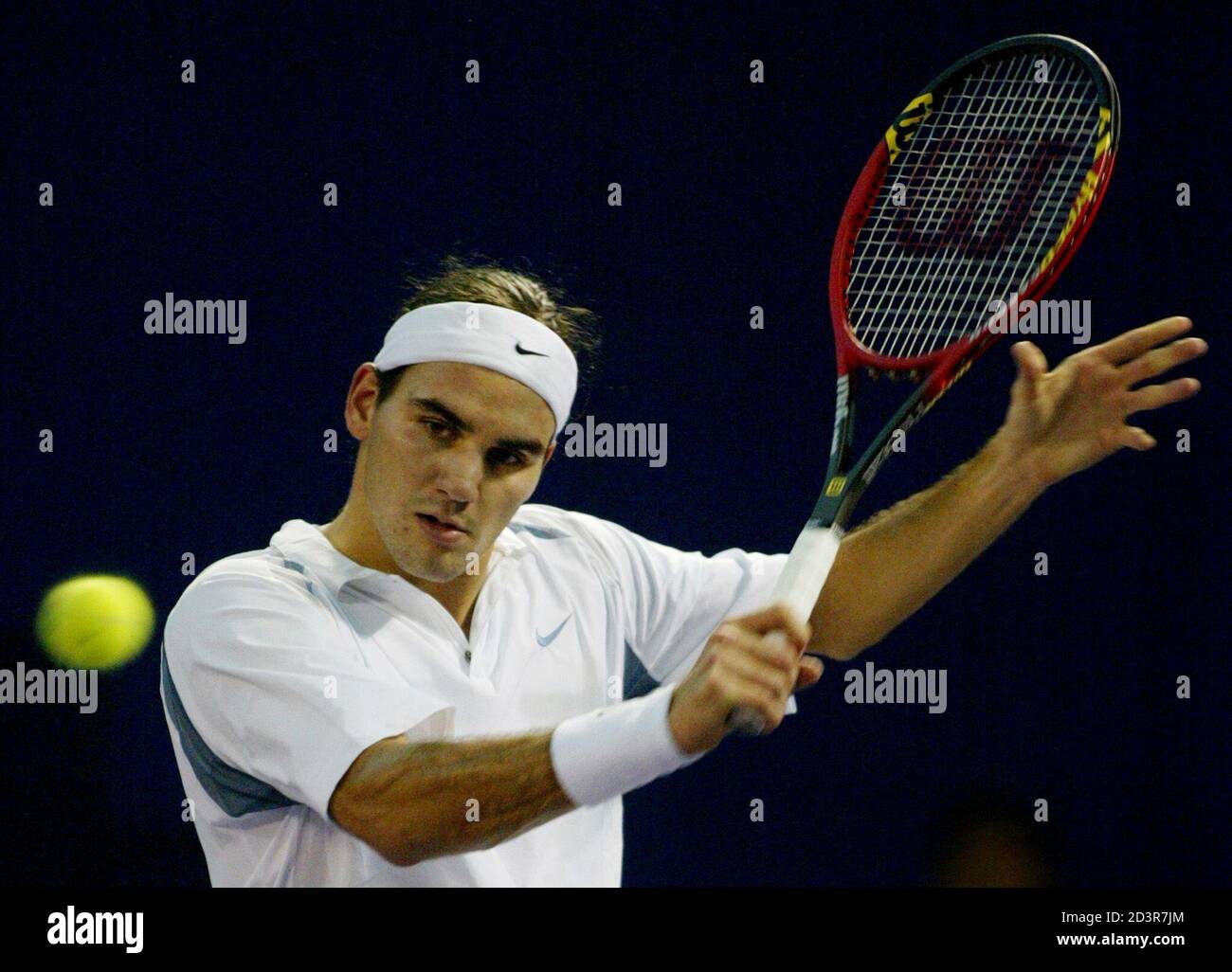 Roger Federer of Switzerland returns a shot during his round robin match  against Jiri Novak of Czech Republic at the Tennis Masters Cup tournament  in Shanghai, China November 14, 2002. Federer beat