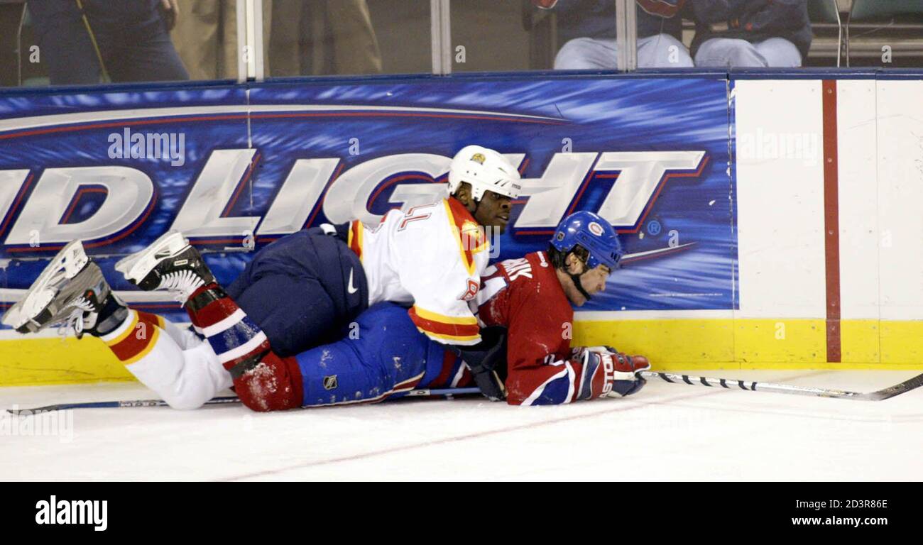Florida Panthers' defenseman Peter Worrell (L) holds down Montreal  Canadiens' winger Randy McKay in the second period of NHL action at the Office  Depot Center in Sunrise, Florida, January 20, 2003. REUTERS/Marc