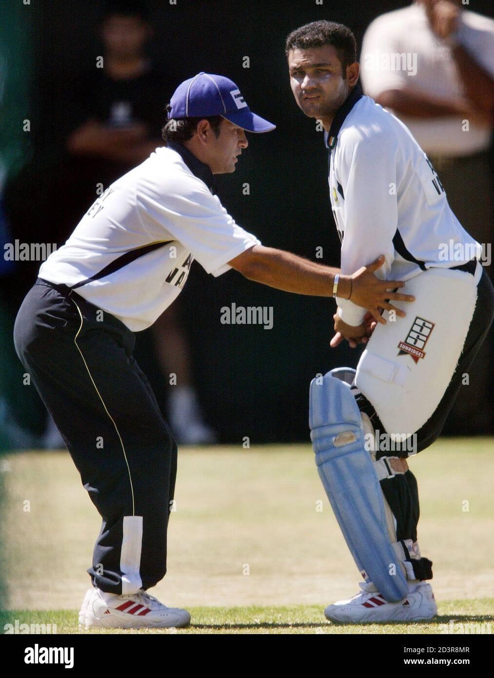 INDIA'S SACHIN TENDULKAR GIVES BATTING TIPS TO TEAMMATE AND OPENING PARTNER  VIRENDER SEHWAG IN CAPE TOWN Stock Photo - Alamy