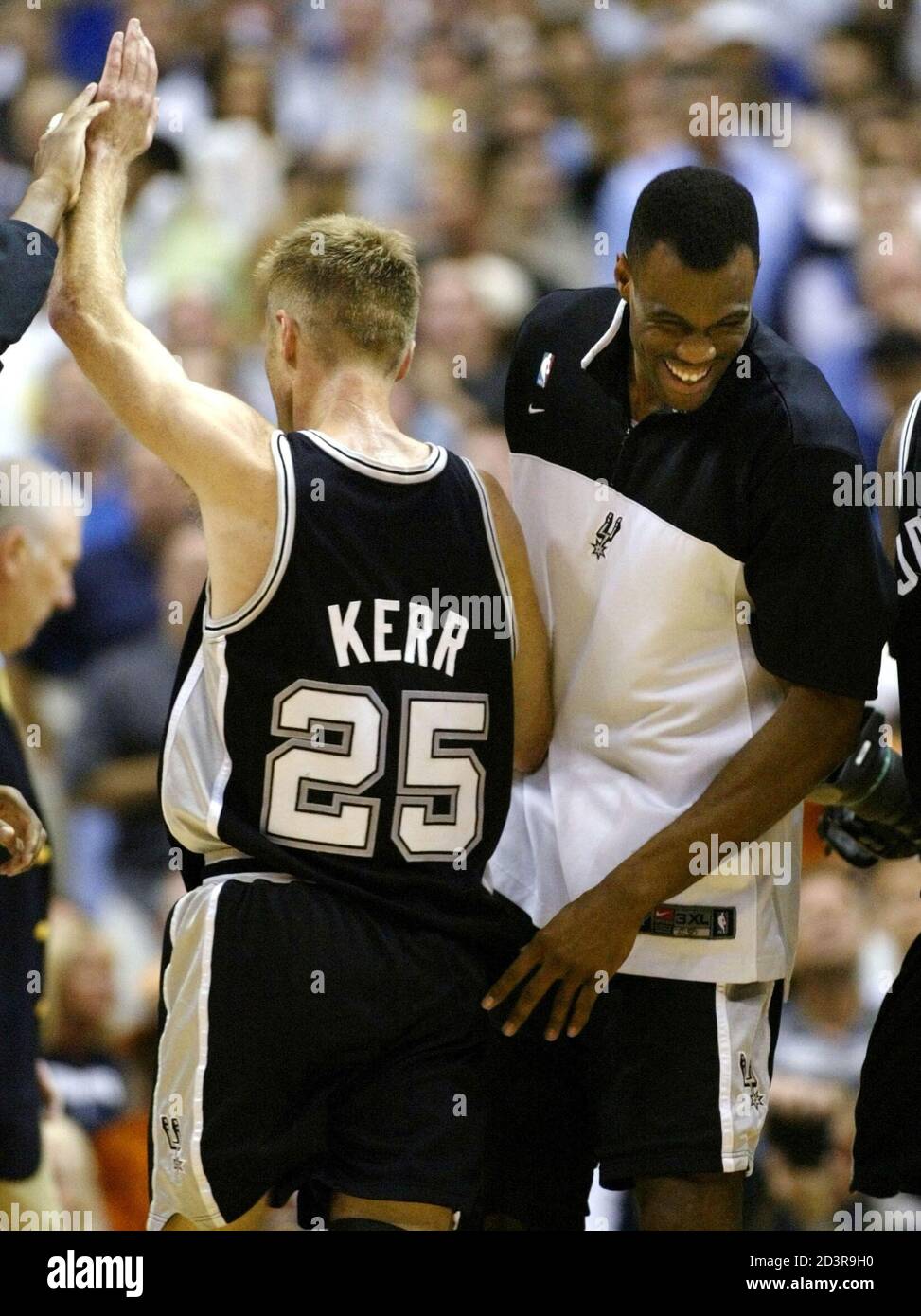 San Antonio Spurs center David Robinson (R) congratulates Spurs guard Steve  Kerr as he comes off the court during a time out during the fourth quarter  of Game 6 in the NBA