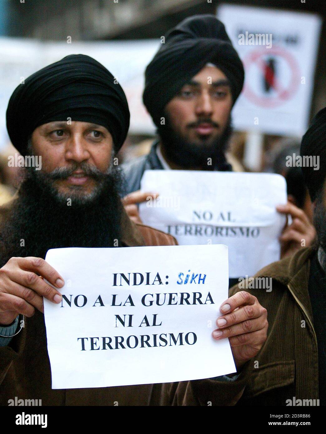 Members of the Indian community living in Catalonia take part in an anti-war march in central Barcelona on the first anniversary of the start of war in Iraq, March 20, 2004. Worldwide protests marked the anniversary of the war in Iraq on Saturday as tens of thousands demanded the U.S.-led coalition pull its troops out of the country scarred by a year of war and insurrection. REUTERS/ Victor Fraile  GN/CRB Stock Photo